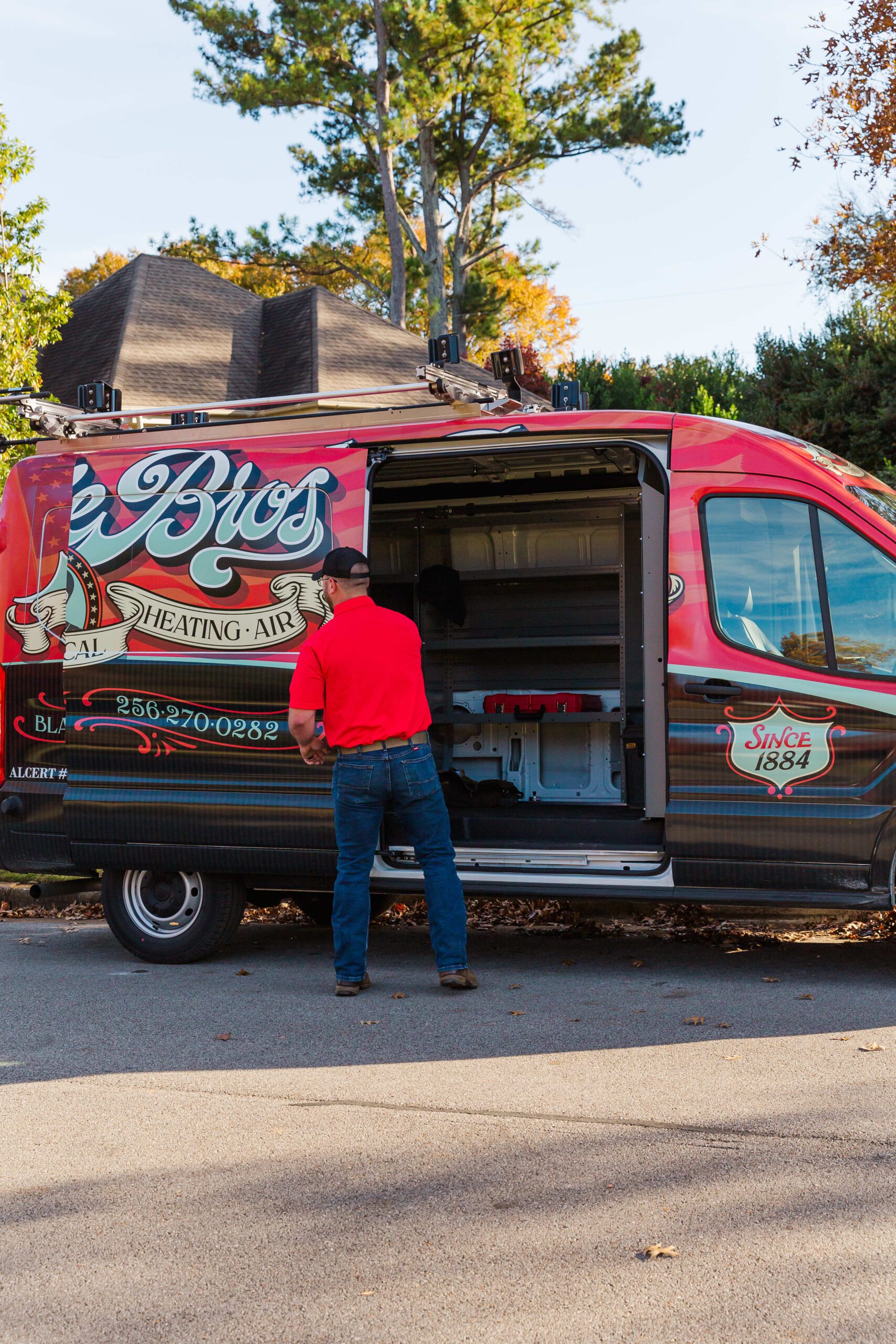 A HVAC Professional Standing in Front of a Blake Brothers Truck