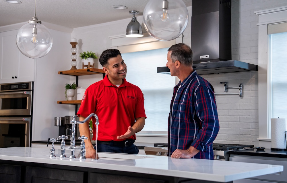 Technician speaking with customer